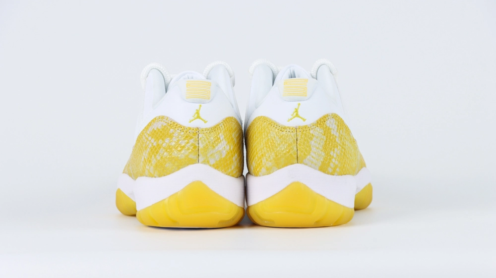 jordan 11 retro low yellow snakeskin (women’s)