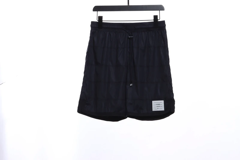 dark plaid nylon covered board shorts